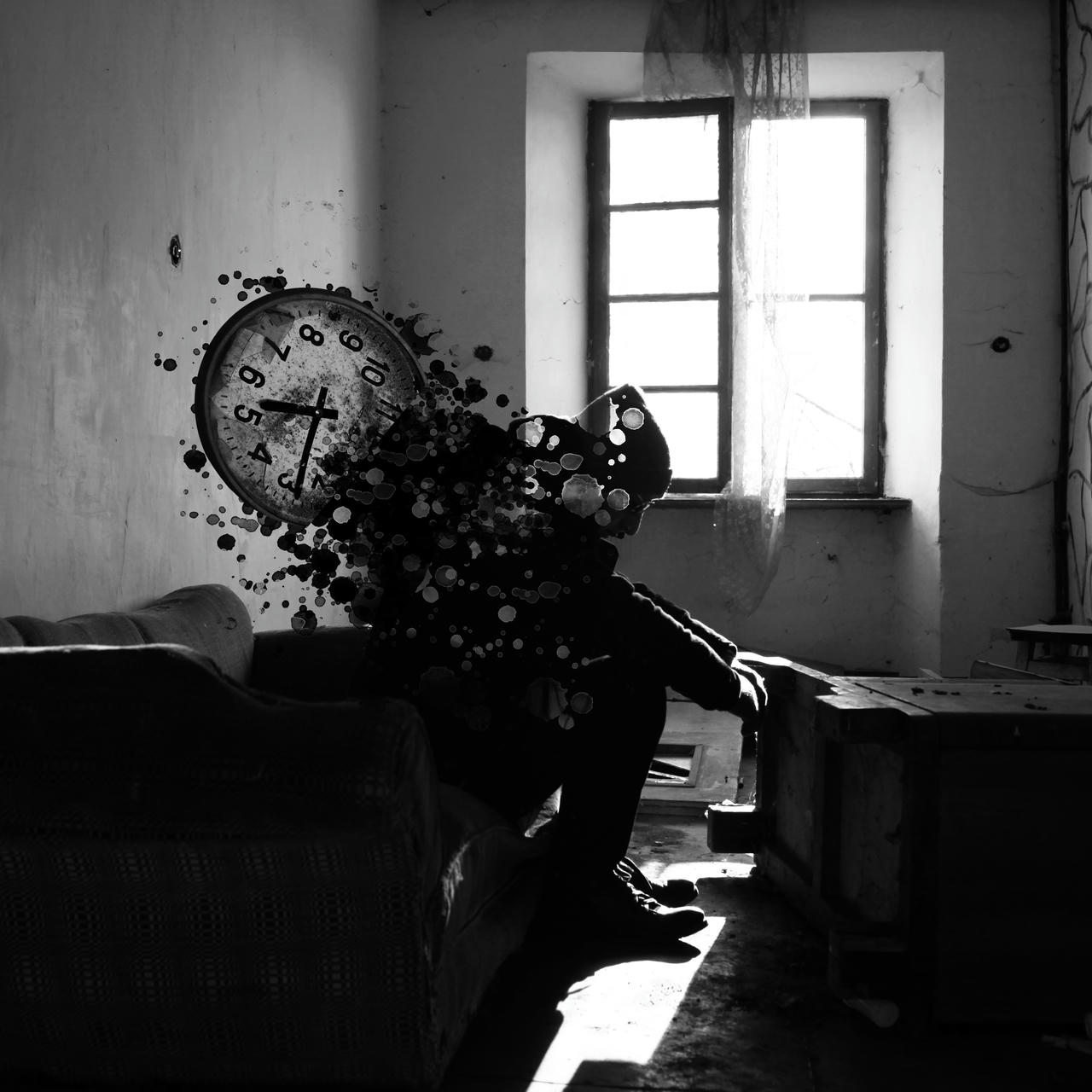 An abandonned room in black and white. A large window lets in bright light. A man sits on a couch, looking down. The back of his silhouette is disintegrating into ink blots and there is a large clock attached to him.